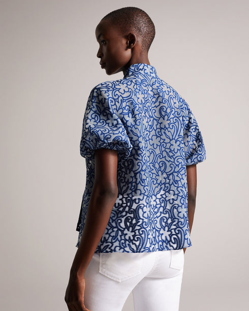 MELODIY-Tops-Add a touch of texture and colour to your outfit with the dreamy MELODIY top. Its paisley design is sure to stand out, while puff sleeves and a neck tie enhance the silhouette. Boxy fit top Semi sheer Jacquard paisley design Short puff sleeves Oversized neck tie High neck Awuoi is 5'10.5" / 1.79m and wears Bright Blue in a Ted size 1- Ted Baker Romania